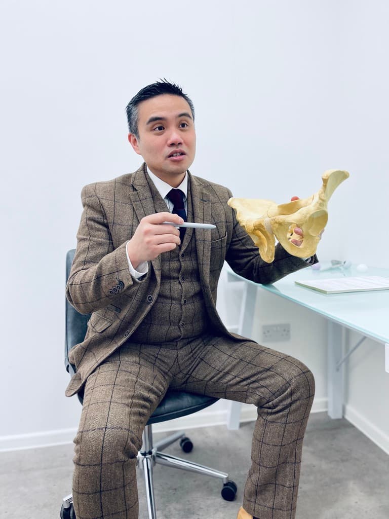 Professor Paul Lee with a pelvis model